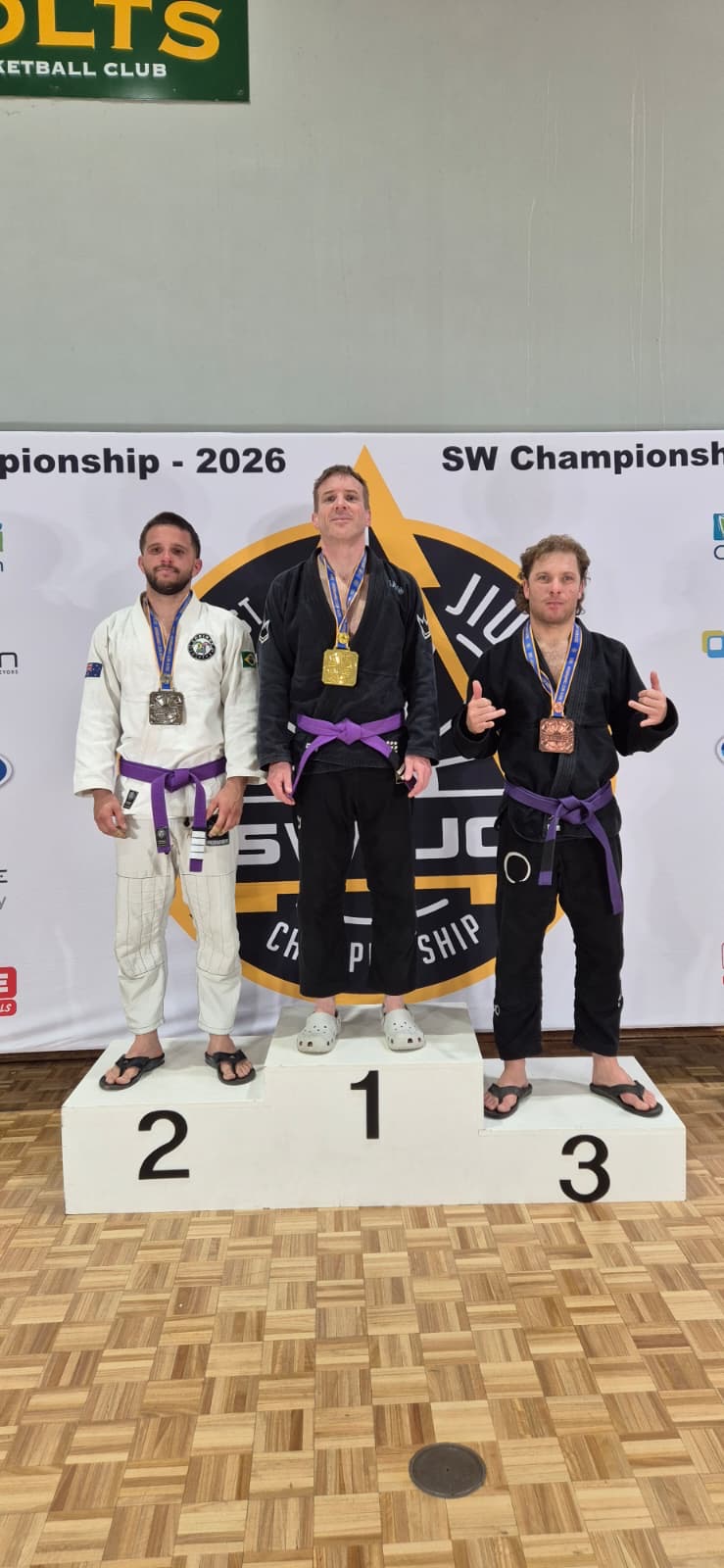 A Mat Shark purple belt on top of the SW Championship podium