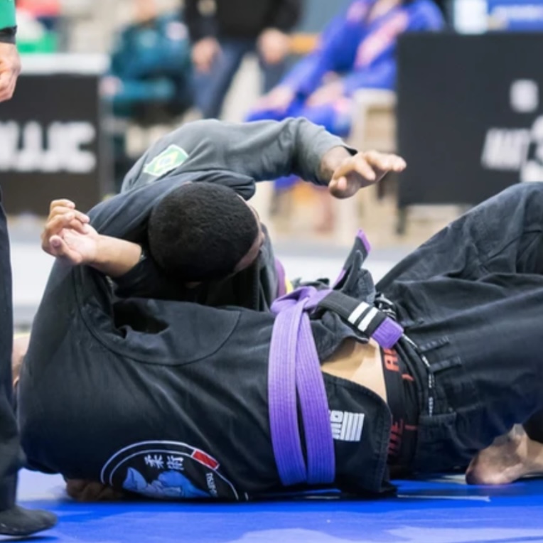A Mat Shark purple belt competing in the gi