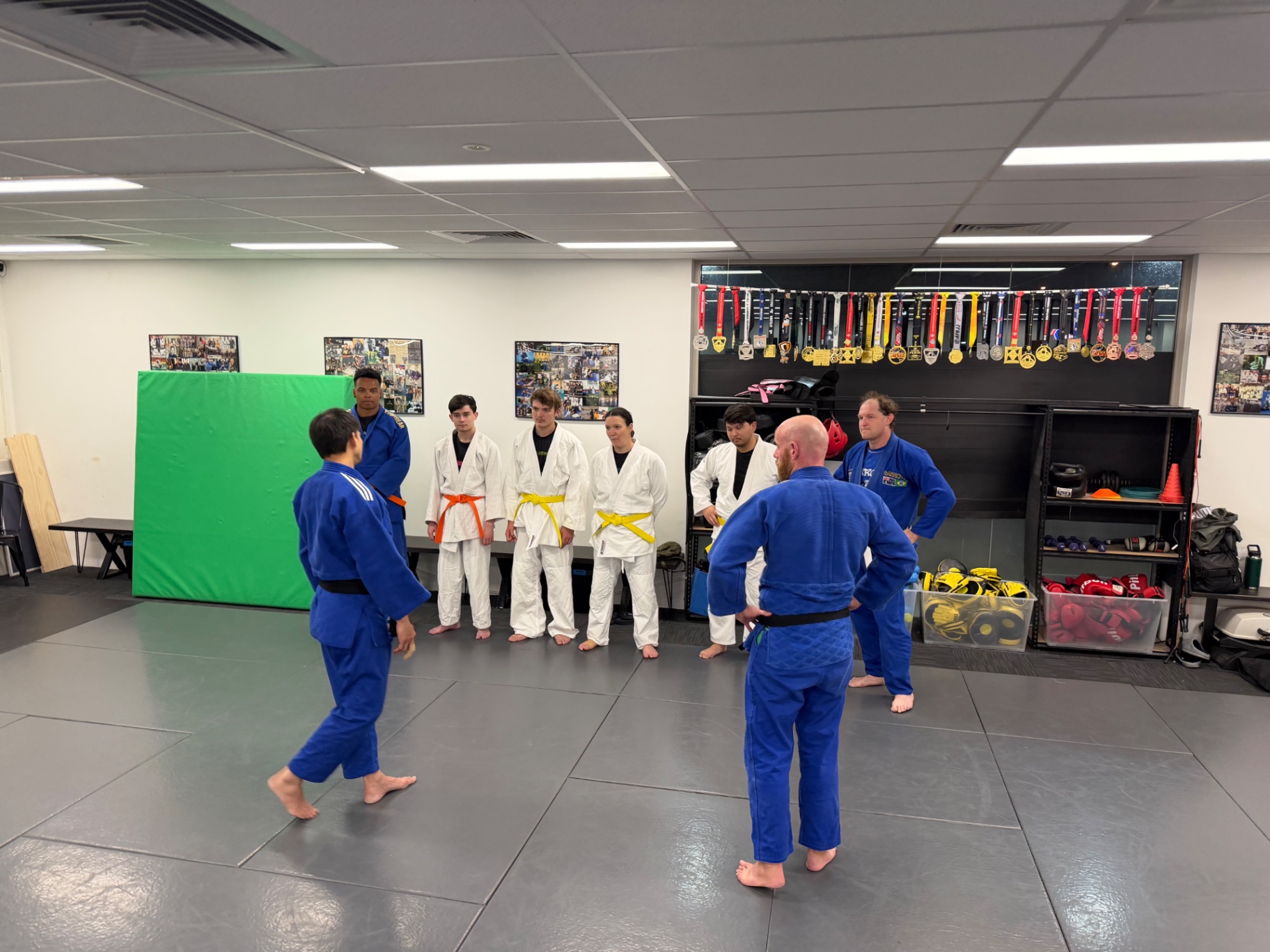A class lined up in gis before training at Mat Shark