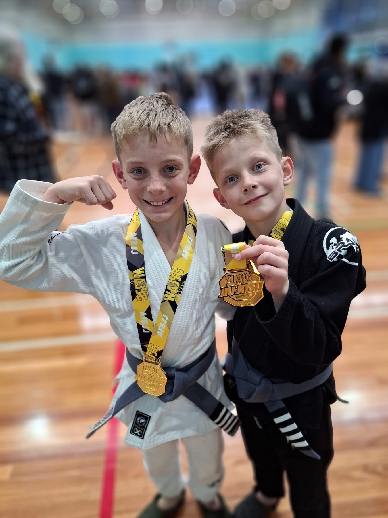 Two young Mat Shark competitors with their WAJJC gold medals