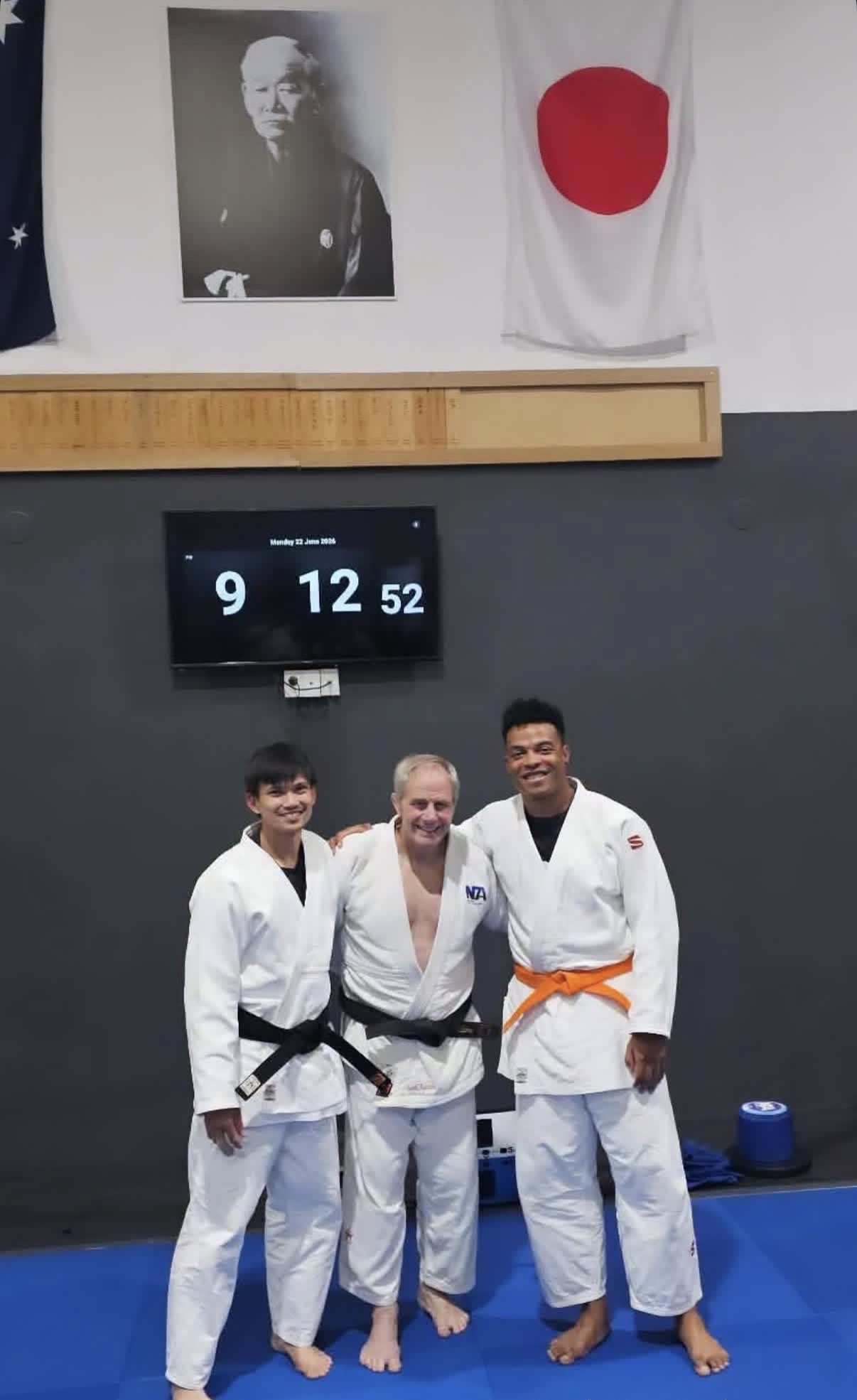Judo students and their coach after a session at Mat Shark