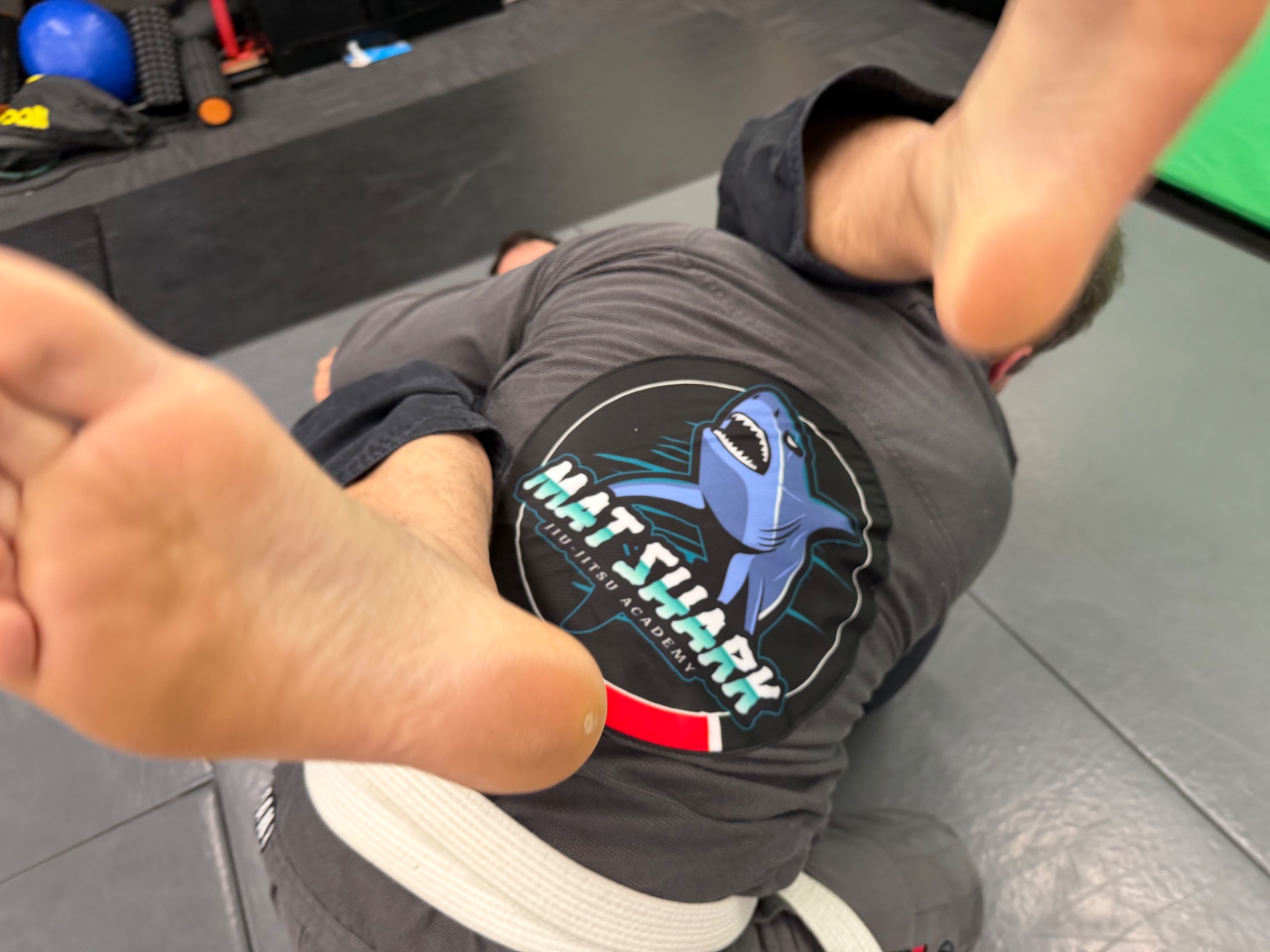 Mat Shark Jiu-Jitsu Academy patch on a student's gi