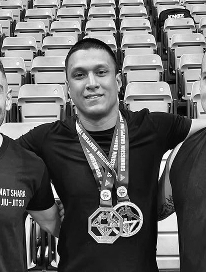 A Mat Shark athlete with his medals after a tournament