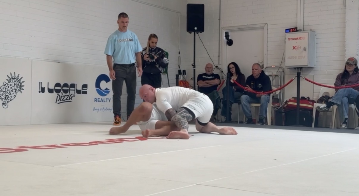 A Mat Shark athlete working from top position during a no-gi superfight