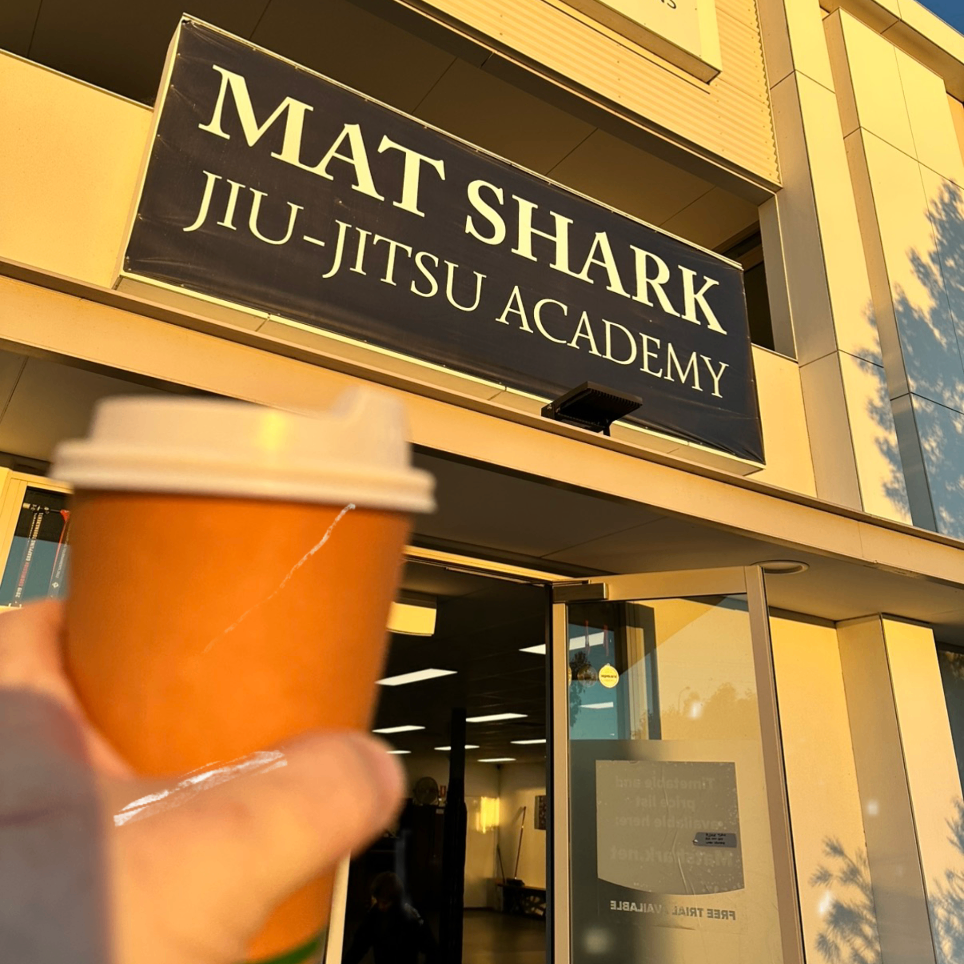 The Mat Shark Jiu-Jitsu Academy sign above the front entrance