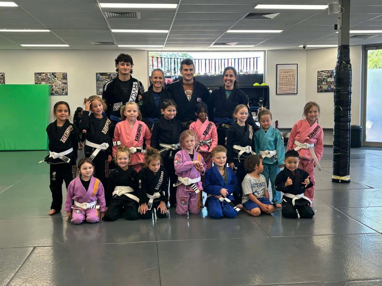 The Mat Shark little kids class group photo with coaches